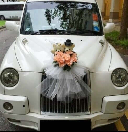 White car with silk flower decoration