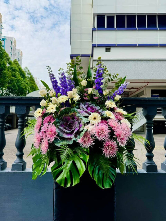 Pink and purple condolence flower stand